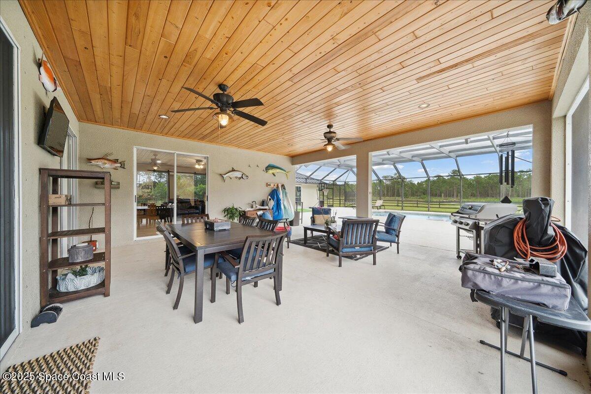 5005 Corey Road Grant Valkaria, FL 32950 - Photo 13 of 47 a view of a dining room with furniture window and outside view