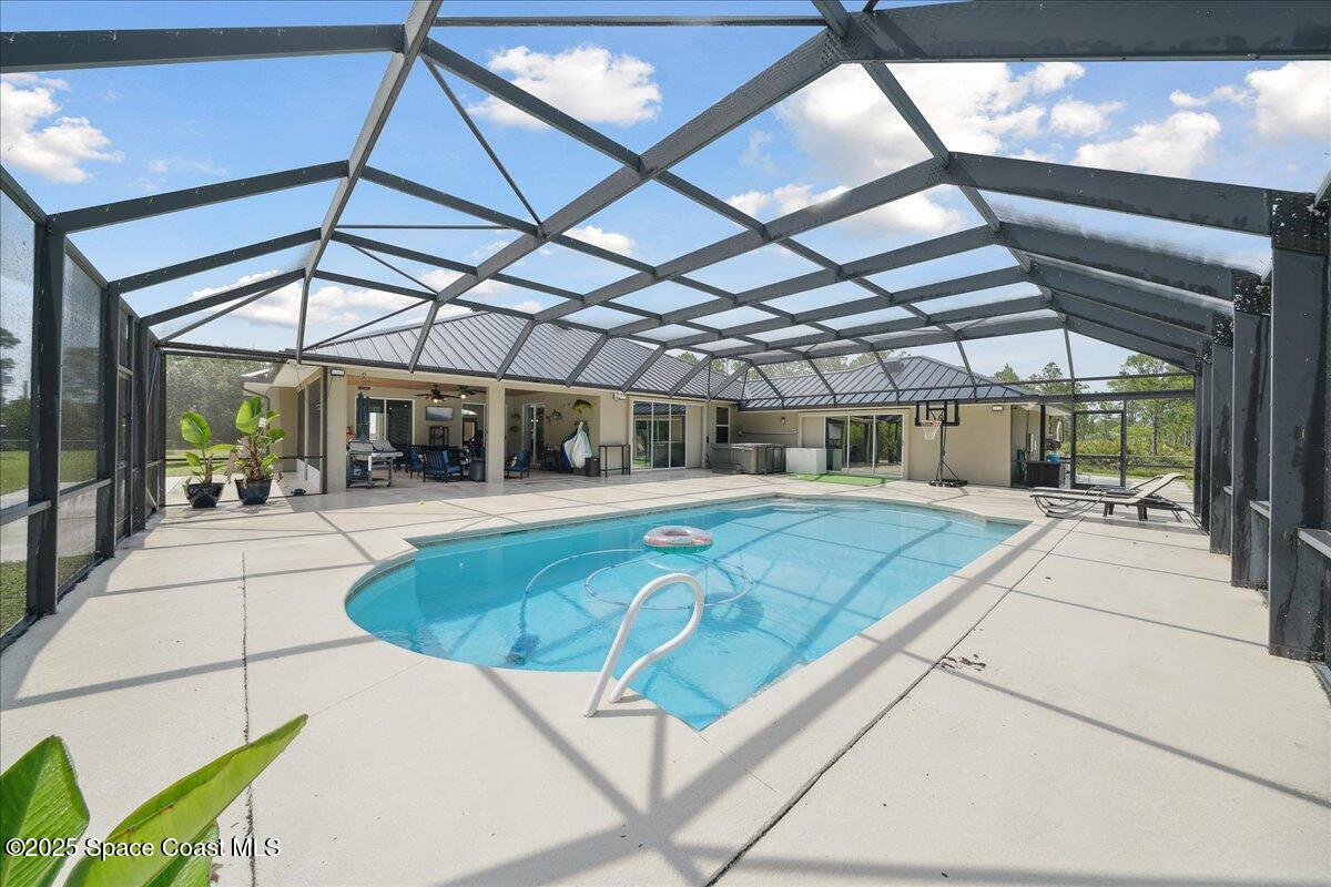 5005 Corey Road Grant Valkaria, FL 32950 - Photo 15 of 47 a view of swimming pool with patio