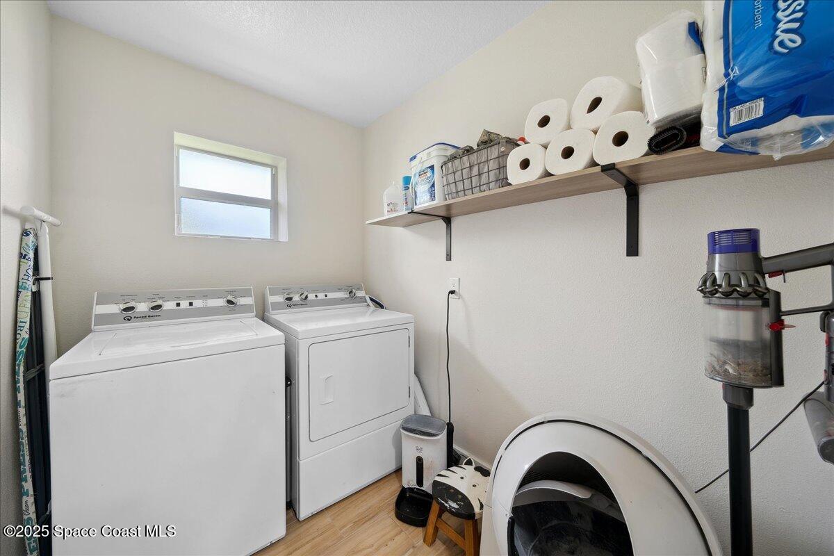 5005 Corey Road Grant Valkaria, FL 32950 - Photo 29 of 47 a utility room with dryer and washer