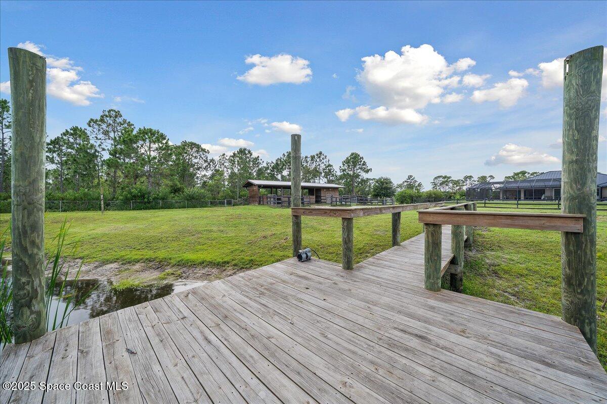 5005 Corey Road Grant Valkaria, FL 32950 - Photo 30 of 47 a park view with a garden space