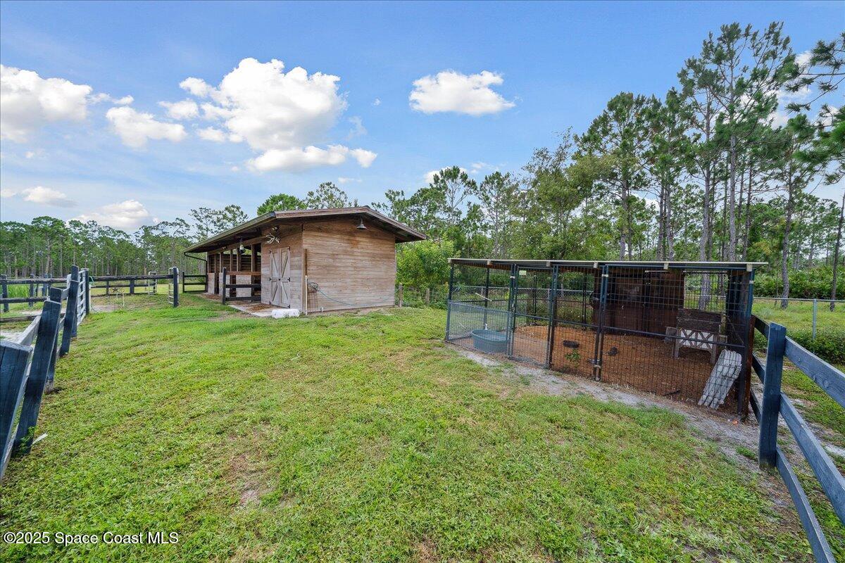 5005 Corey Road Grant Valkaria, FL 32950 - Photo 33 of 47 a garden view with a seating space