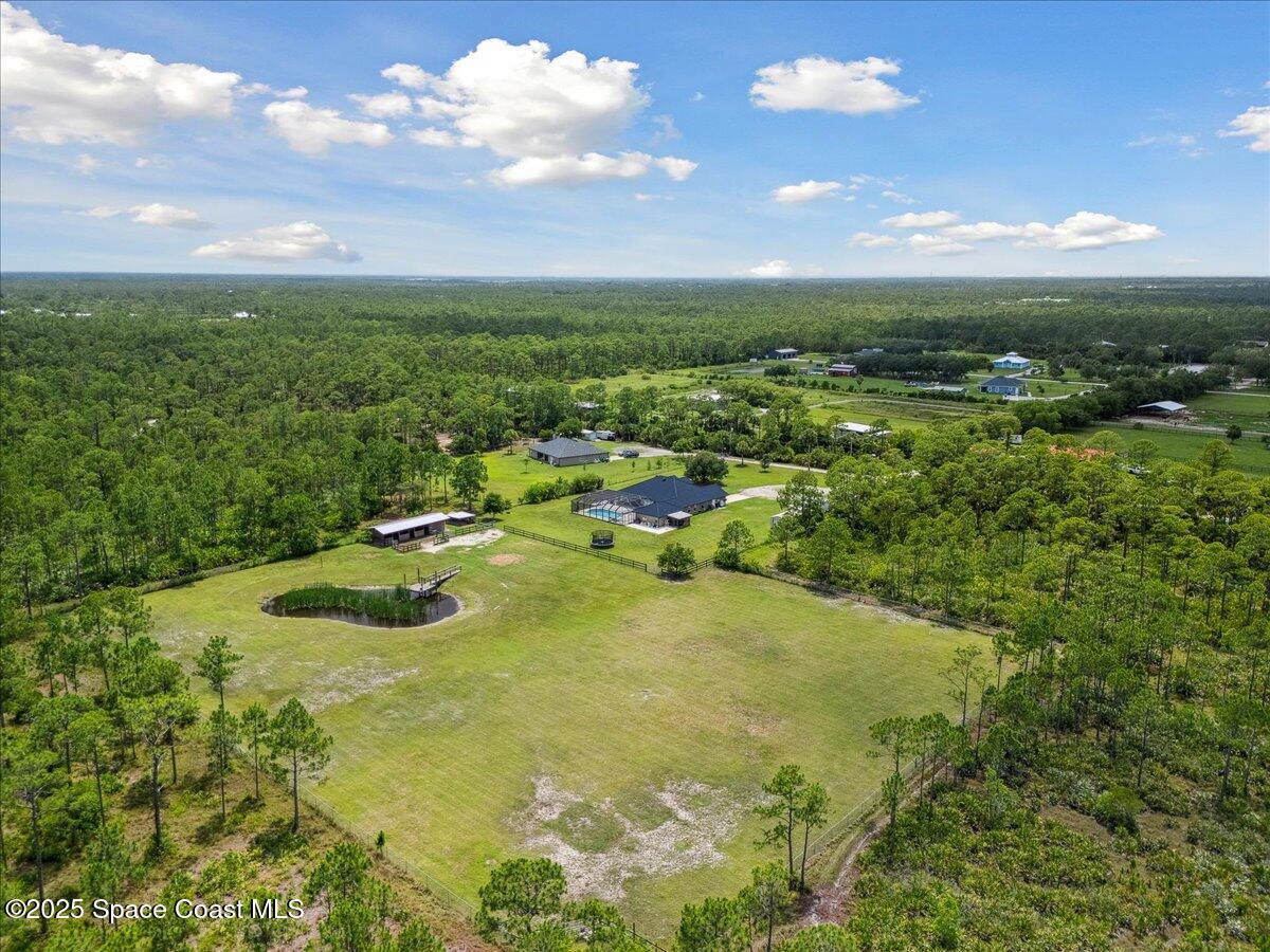 5005 Corey Road Grant Valkaria, FL 32950 - Photo 4 of 47 a view of a lake with outdoor space