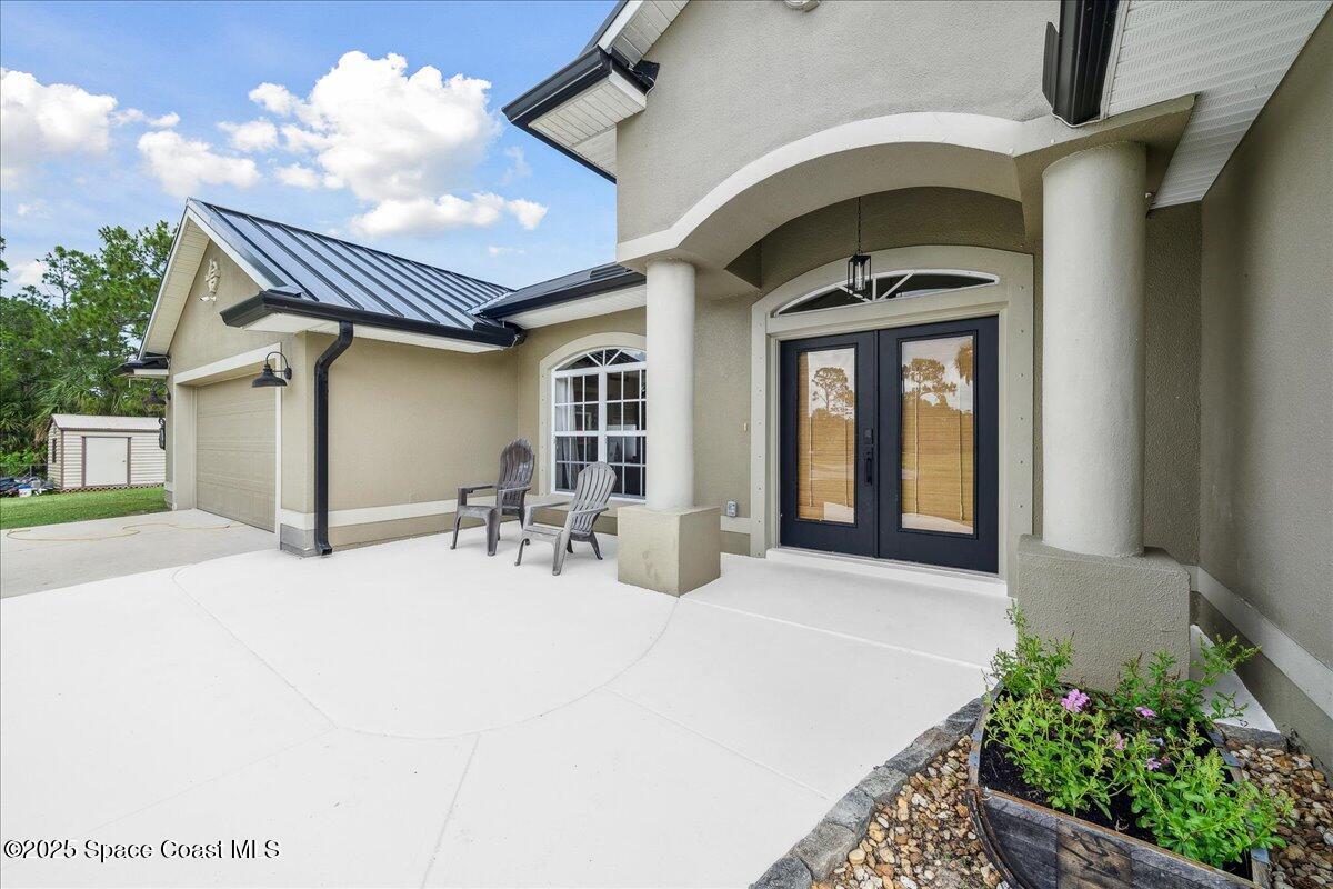 5005 Corey Road Grant Valkaria, FL 32950 - Photo 5 of 47 a view of swimming pool with outdoor seating