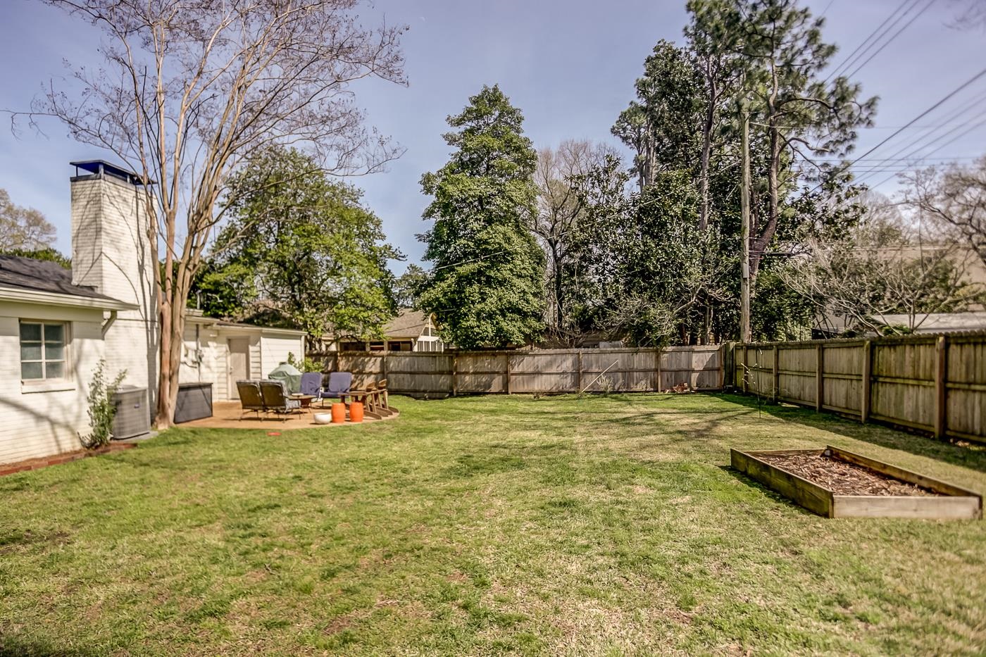 4697 Sequoia Road Memphis, TN 38117 - Photo 15 of 15 a view of a yard with trees in the background
