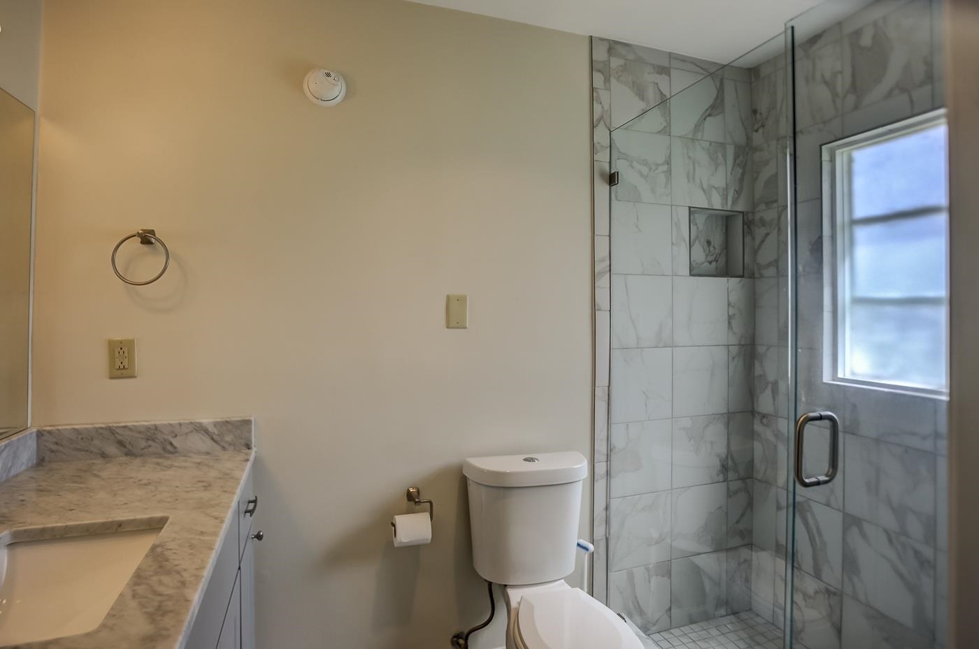 4697 Sequoia Road Memphis, TN 38117 - Photo 6 of 15 a bathroom with a granite countertop sink toilet and shower