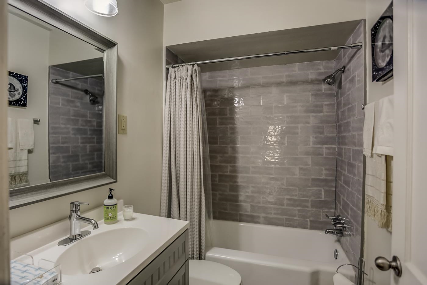 4697 Sequoia Road Memphis, TN 38117 - Photo 9 of 15 a bathroom with a granite countertop shower sink vanity and mirror