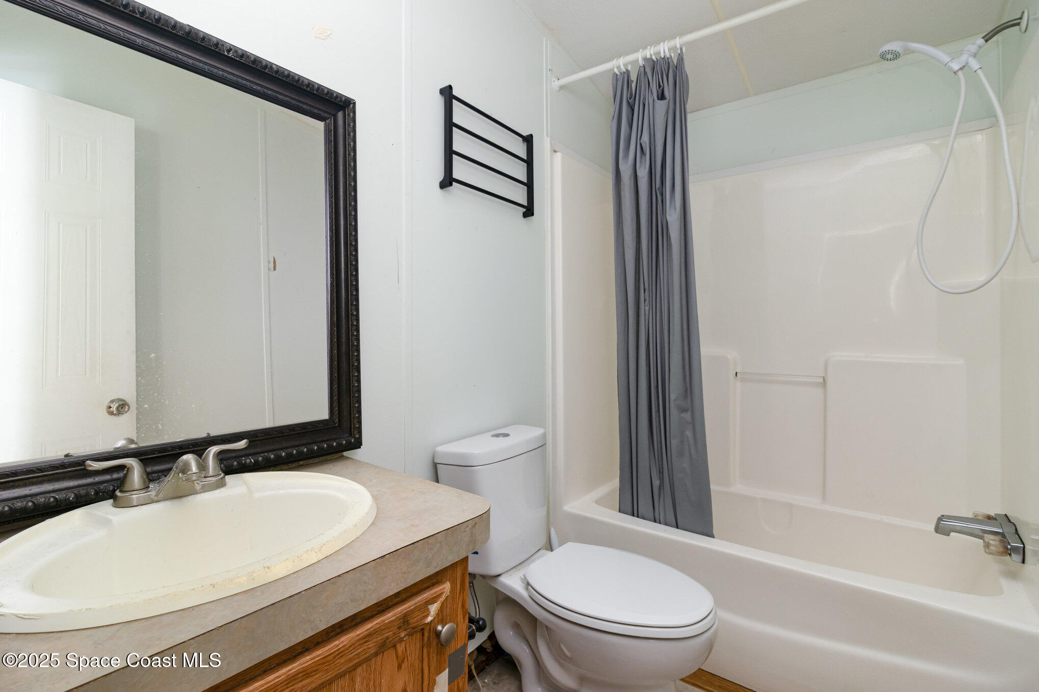 344 Robyn Street Cocoa, FL 32927 - Photo 11 of 21 a bathroom with a sink toilet and shower
