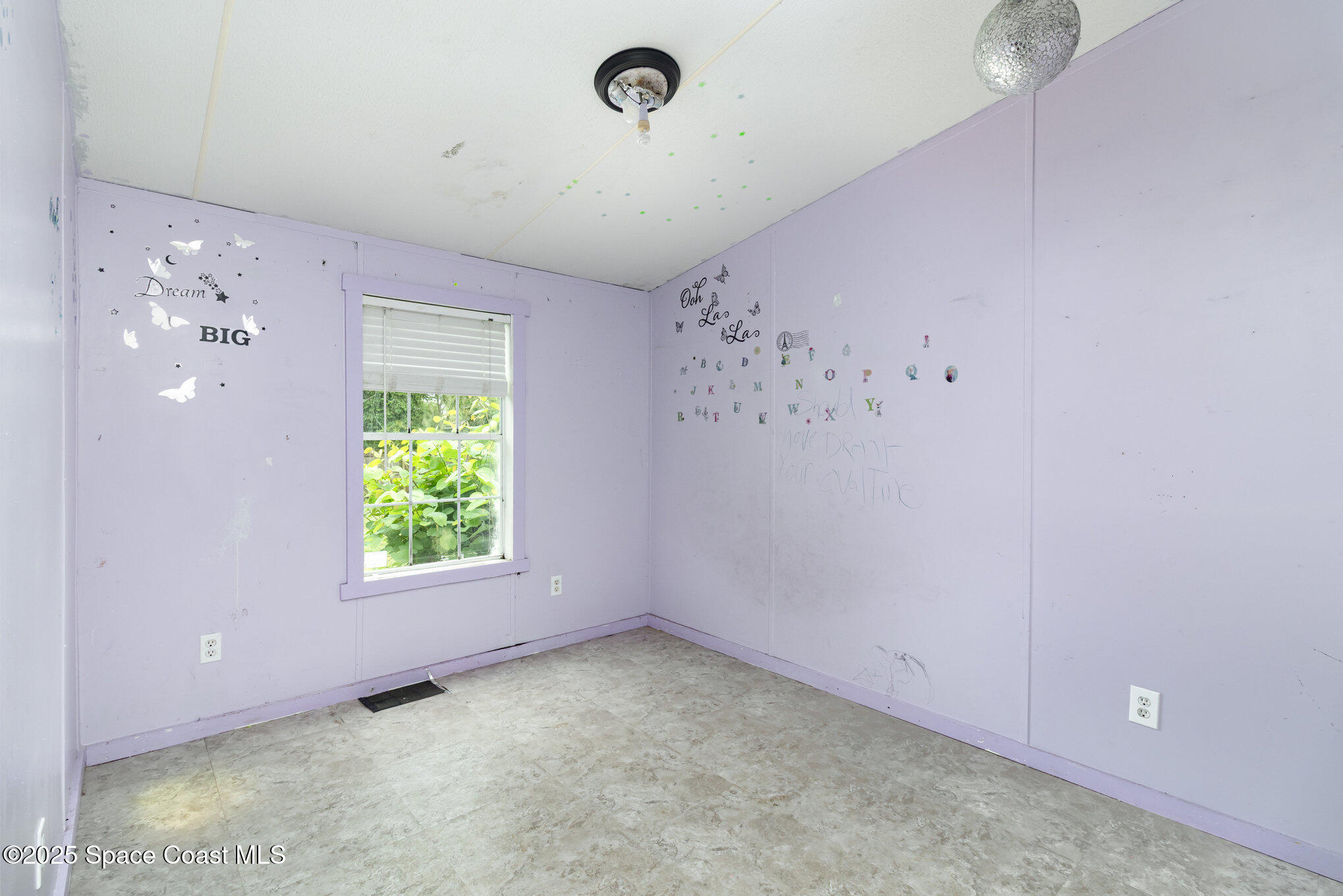 344 Robyn Street Cocoa, FL 32927 - Photo 12 of 21 a view of an empty room with a window