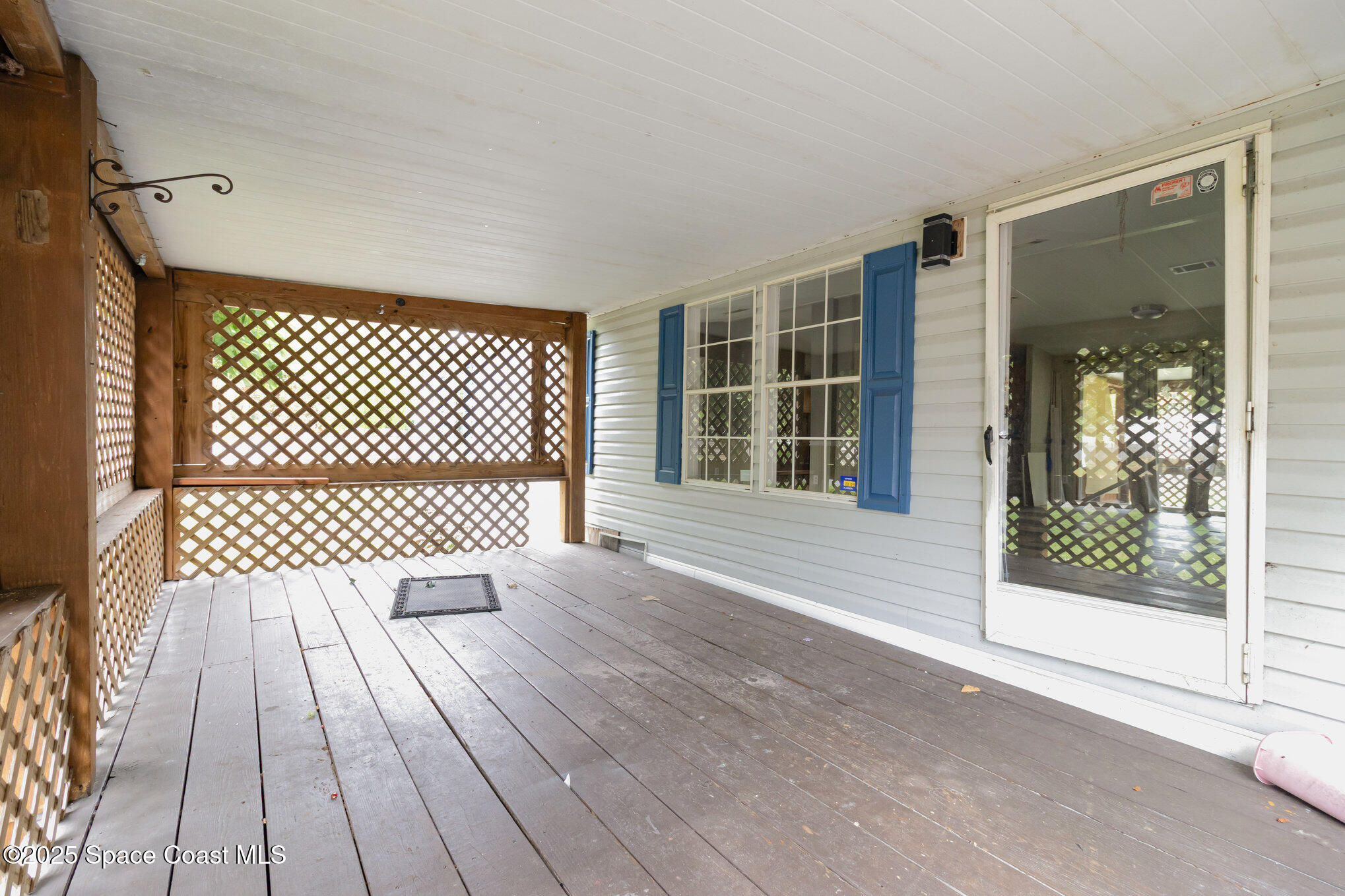 344 Robyn Street Cocoa, FL 32927 - Photo 16 of 21 a view of a room with wooden floor