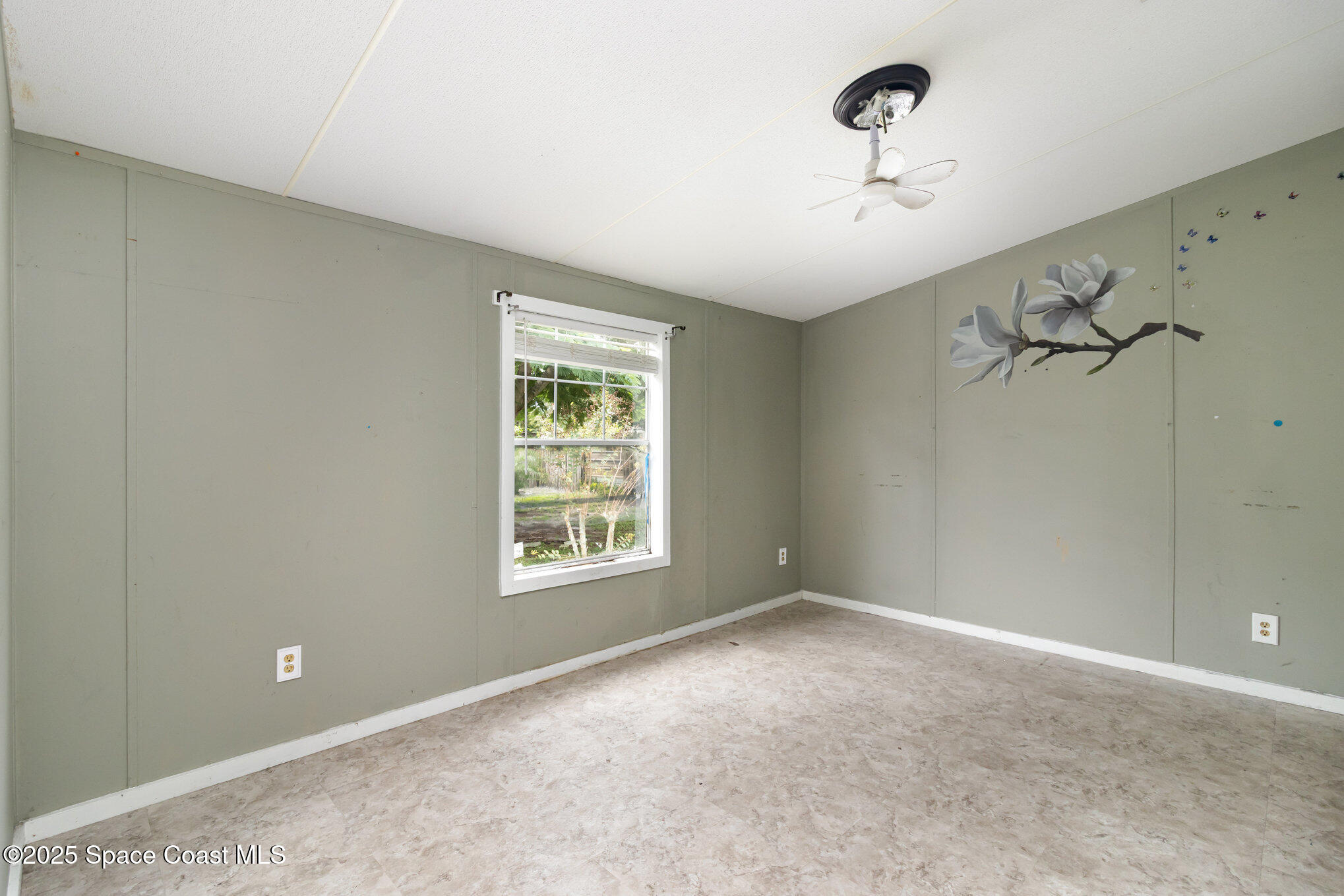 344 Robyn Street Cocoa, FL 32927 - Photo 6 of 21 a view of an empty room with a window