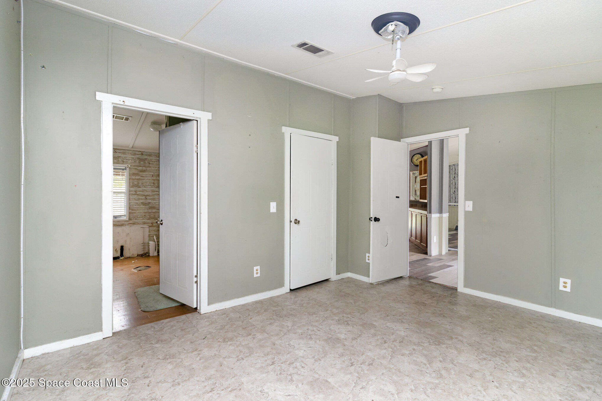 344 Robyn Street Cocoa, FL 32927 - Photo 7 of 21 wooden floor in an empty room with a bathroom