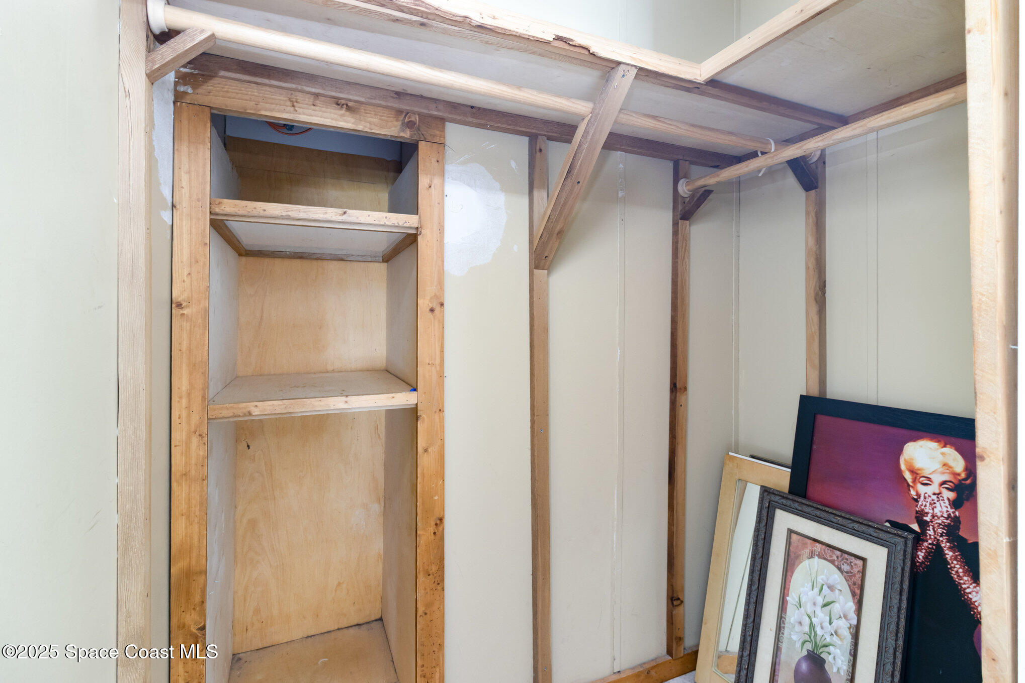 344 Robyn Street Cocoa, FL 32927 - Photo 8 of 21 a utility room with a wooden door