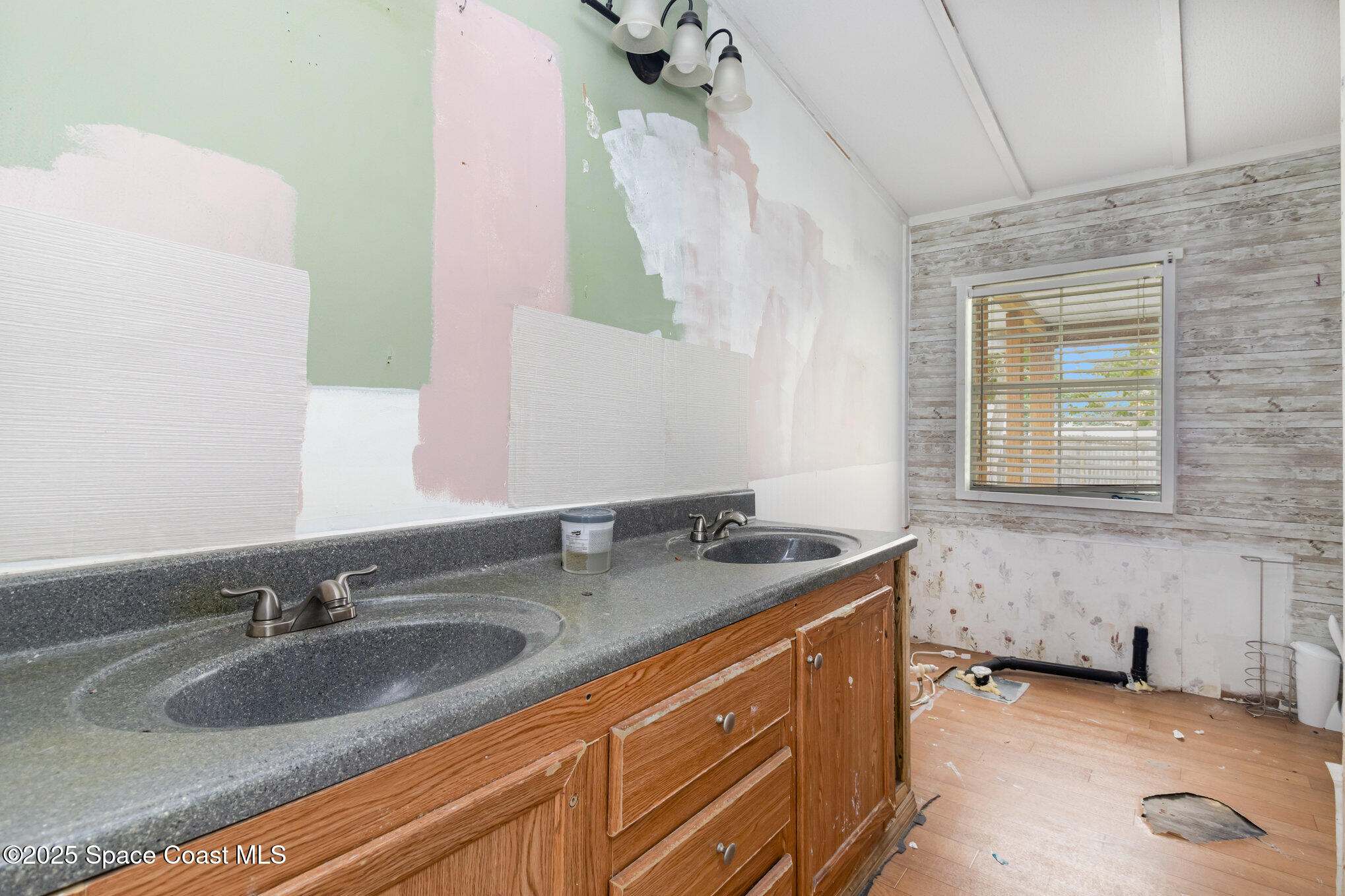 344 Robyn Street Cocoa, FL 32927 - Photo 9 of 21 a bathroom with a granite countertop sink and a mirror