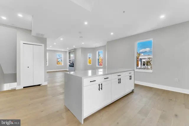 a large white room with chandelier