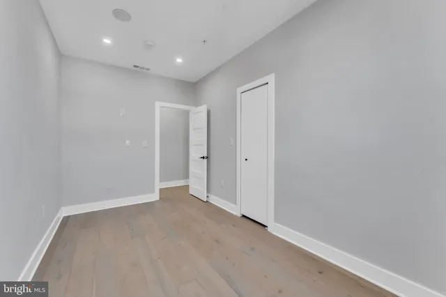 a bathroom with a sink a mirror and a toilet
