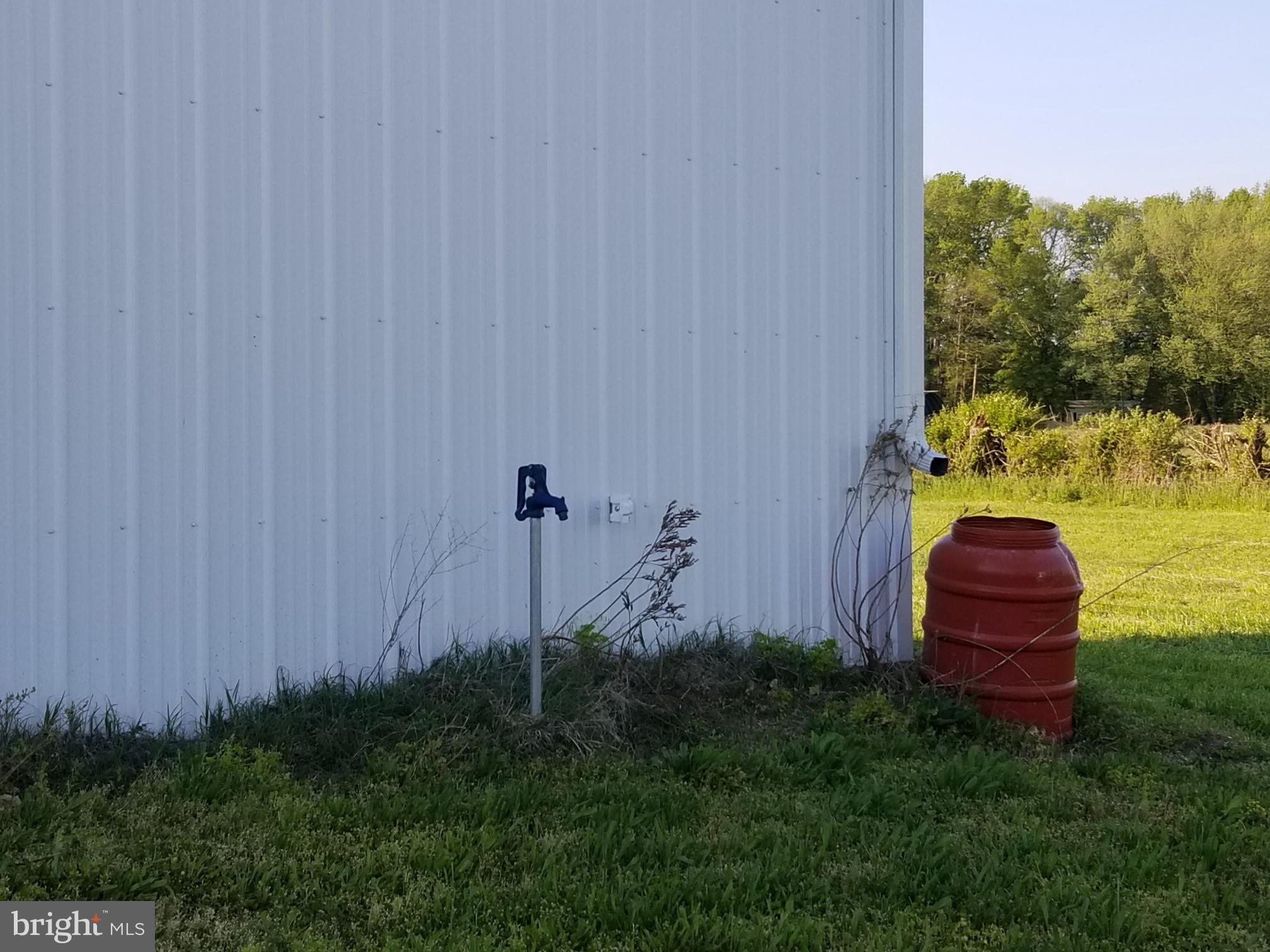 4938 Halltown Road Hartly, DE 19953 - Photo 15 of 32 water faucet in front of big barn