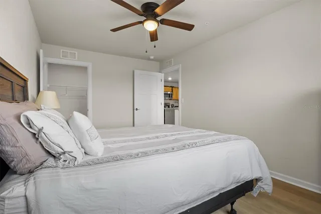 a bed room with a bed and a chandelier