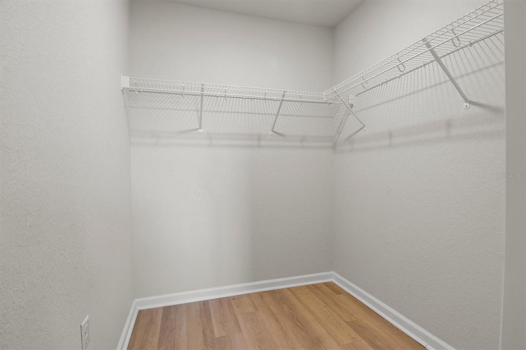 260 Spanish Moss Circle, Unit 101 Sebring, FL 33876 - Photo 13 of 35 a view of a room with racks on the wall