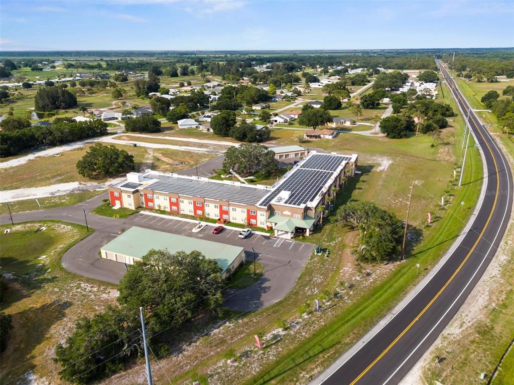 260 Spanish Moss Circle, Unit 101 Sebring, FL 33876 - Photo 20 of 35 an aerial view of a swimming pool and outdoor seating