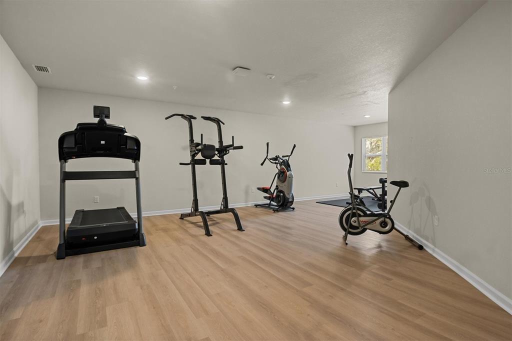 260 Spanish Moss Circle, Unit 101 Sebring, FL 33876 - Photo 26 of 35 a view of a room with gym equipment