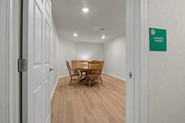 a view of a livingroom with furniture and an entryway
