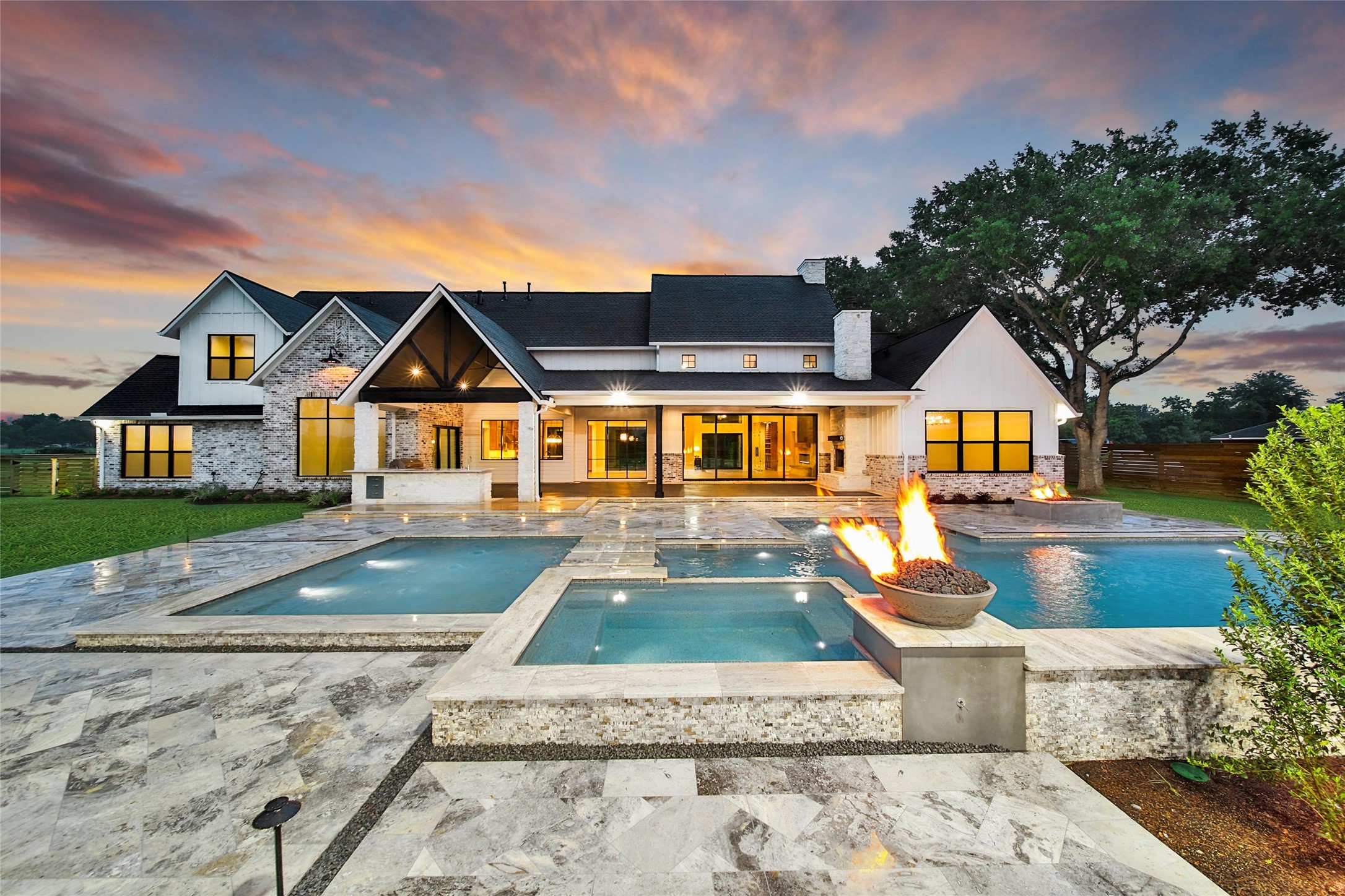 a view of house with garden space and sitting area