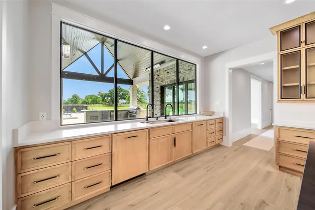 a large kitchen with a window