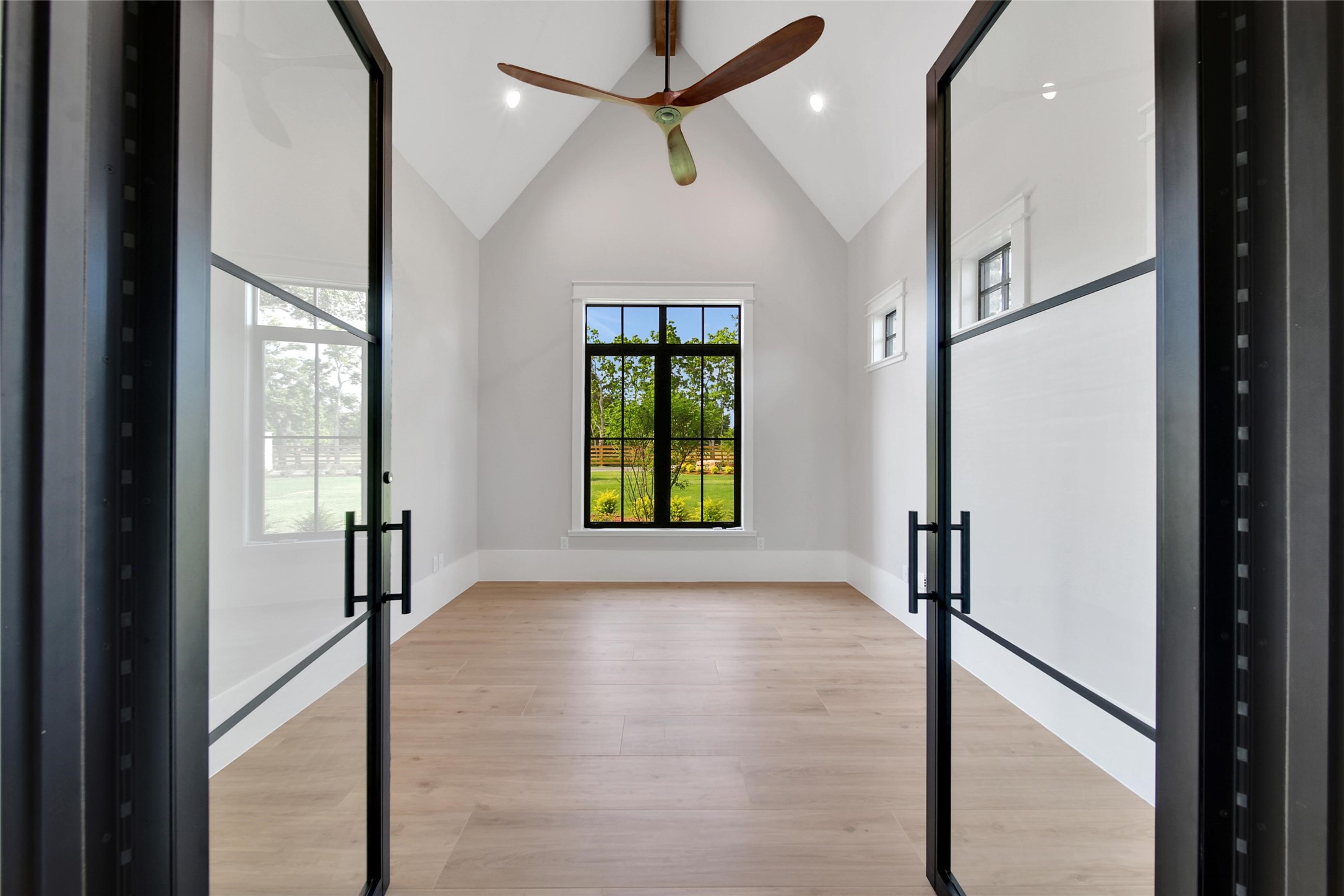 18829 Cypress Church Road Cypress, TX 77433 - Photo 20 of 50 a view of hallway with windows and chandelier