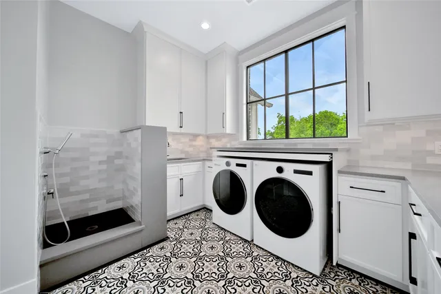 a utility room with dryer and washer