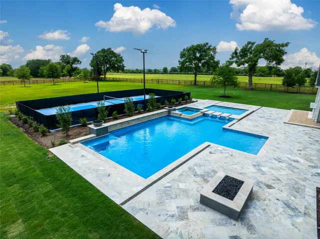 a view of swimming pool with a yard