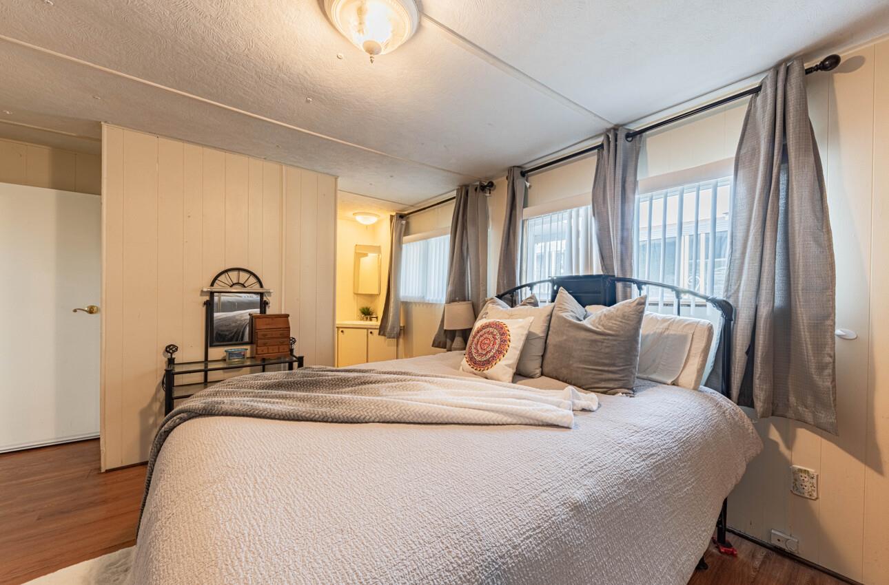 55 San Juan Grade Road, Unit 79 Salinas, CA 93906 - Photo 12 of 22 a bedroom with bed and a window