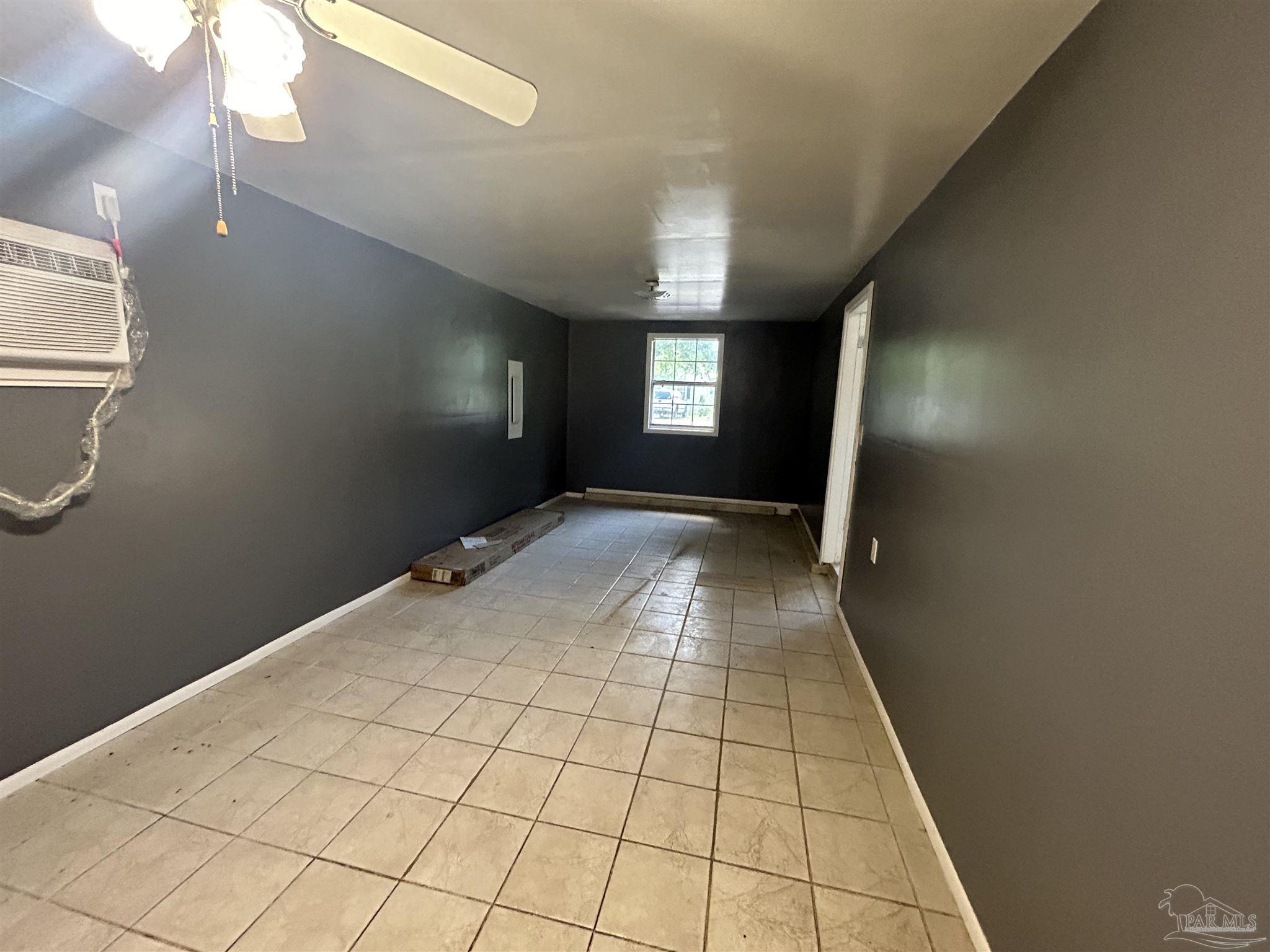 210 Milton Road Pensacola, FL 32507 - Photo 11 of 17 a view of an empty room and window