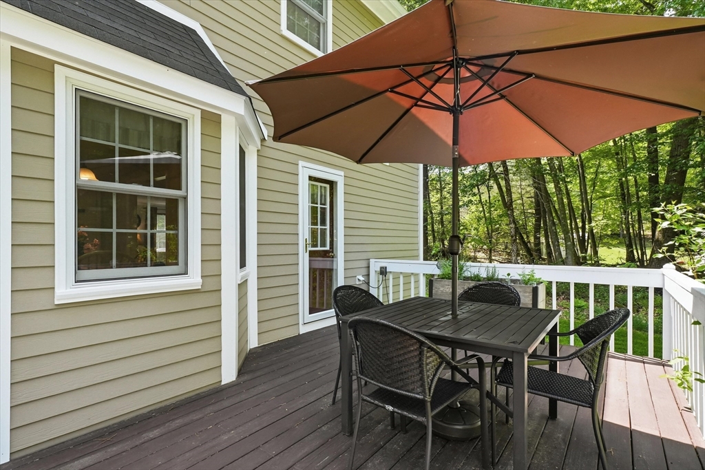 9 Fazio Farm Road Georgetown, MA 01833 - Photo 34 of 42 an outdoor space with furniture and umbrella