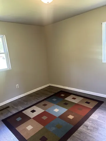 an empty room with wooden floor