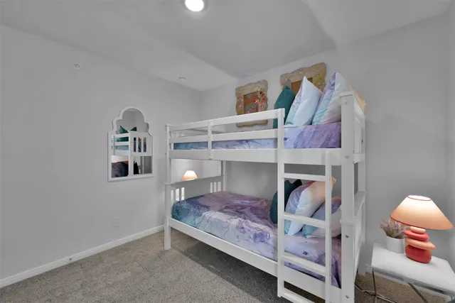 a bedroom with a bed and closet