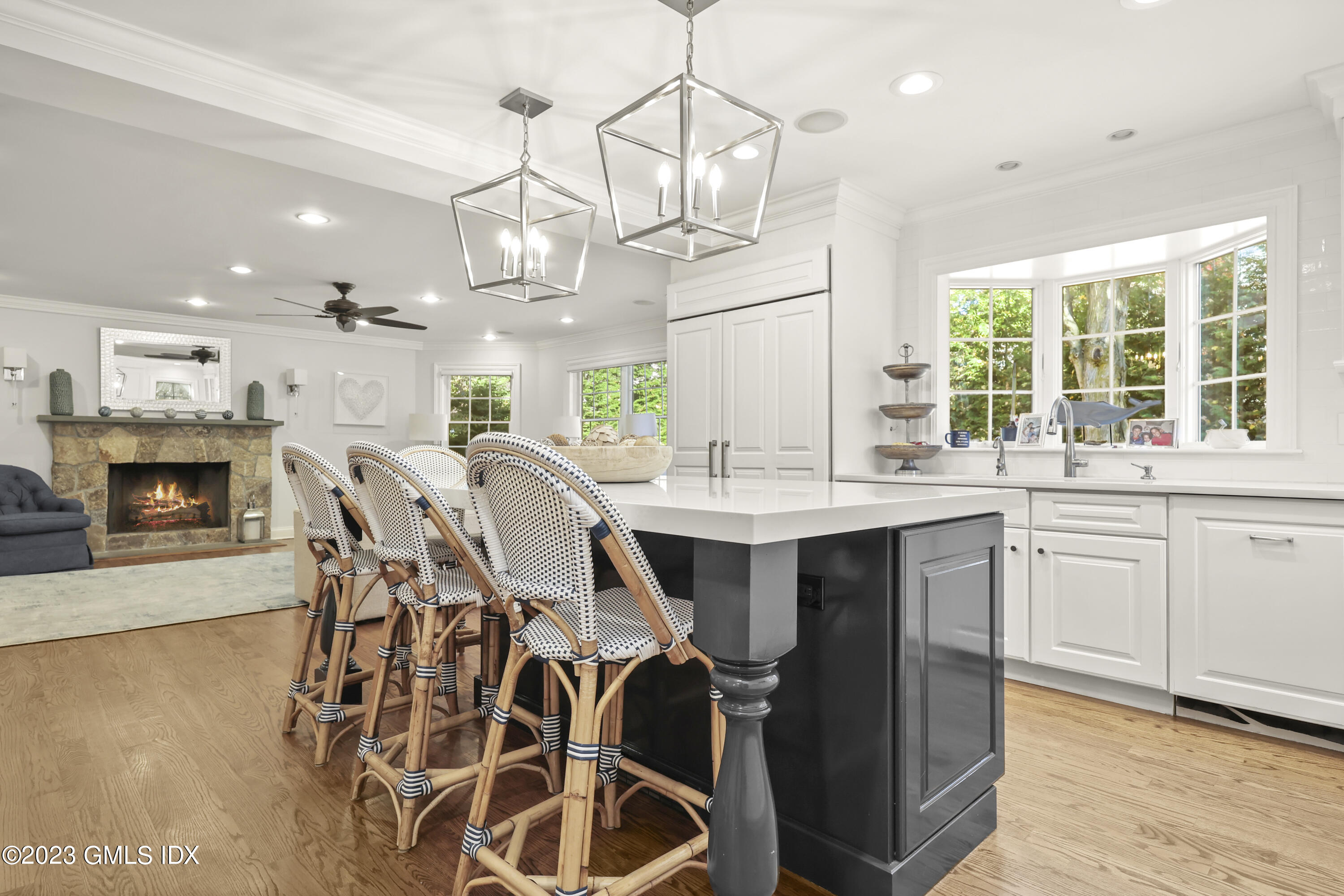 14 Rainbow Drive Riverside, CT 06878 - Photo 10 of 29 a kitchen with stainless steel appliances a table chairs and chandelier