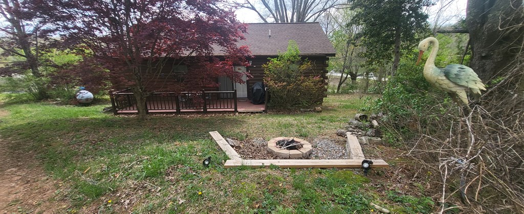 2209 Bellview Lane Young Harris, GA 30582 - Photo 15 of 16 a view of a wooden house with a yard