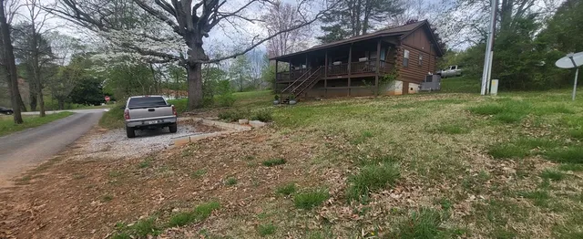 a backyard of a house with lots of green space