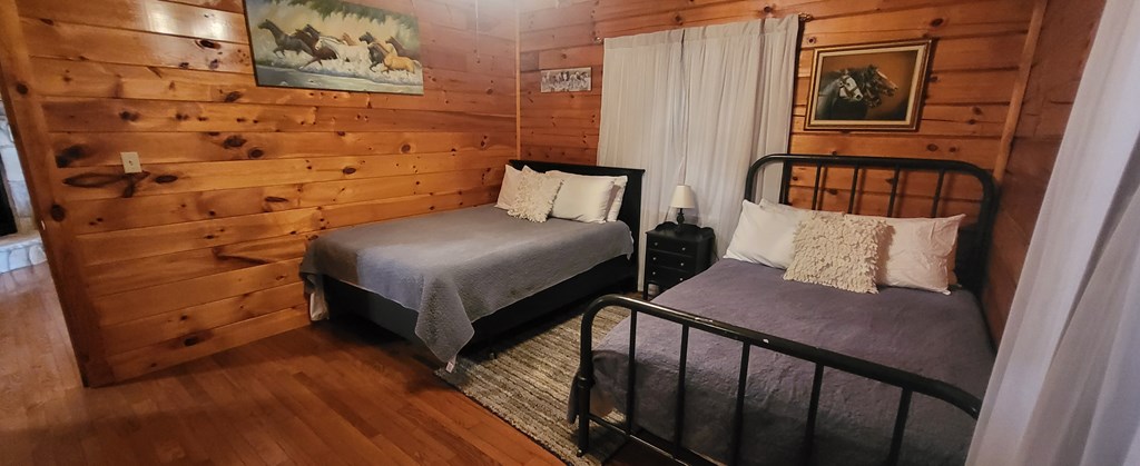 2209 Bellview Lane Young Harris, GA 30582 - Photo 5 of 16 a bedroom with a bed and wall painting