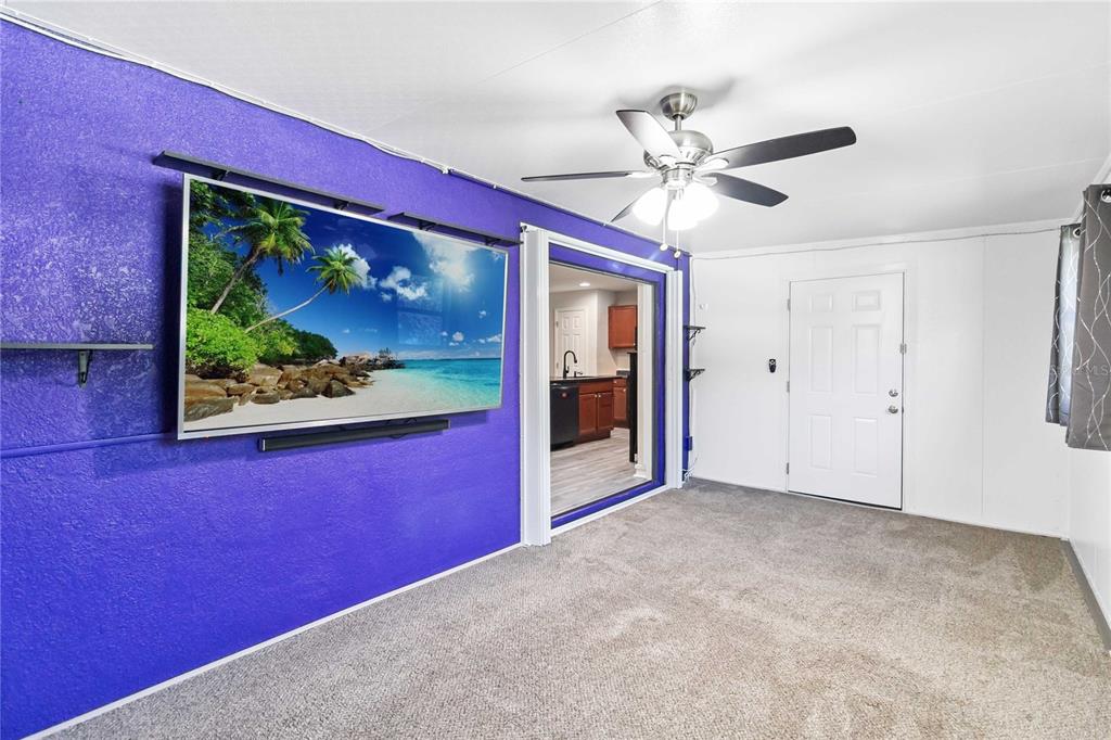 3723 Ricky Lane St. Cloud, FL 34772 - Photo 14 of 36 a view of a room with a fan and windows