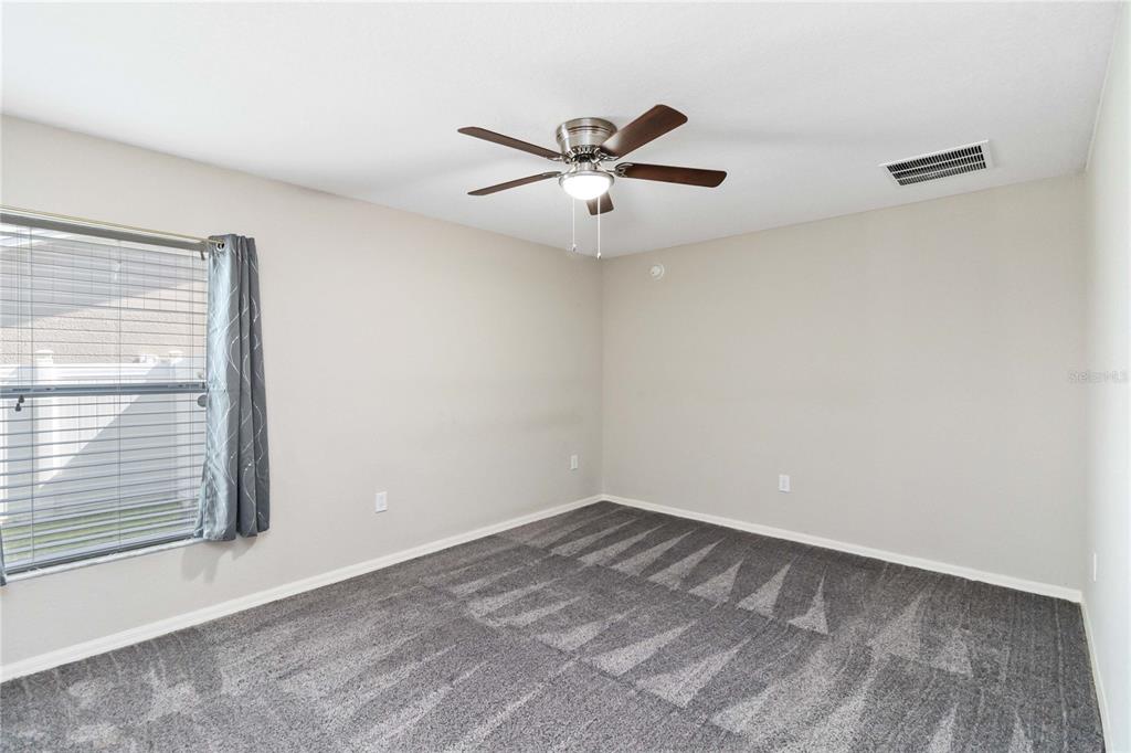 3723 Ricky Lane St. Cloud, FL 34772 - Photo 15 of 36 a view of a big room with carpet