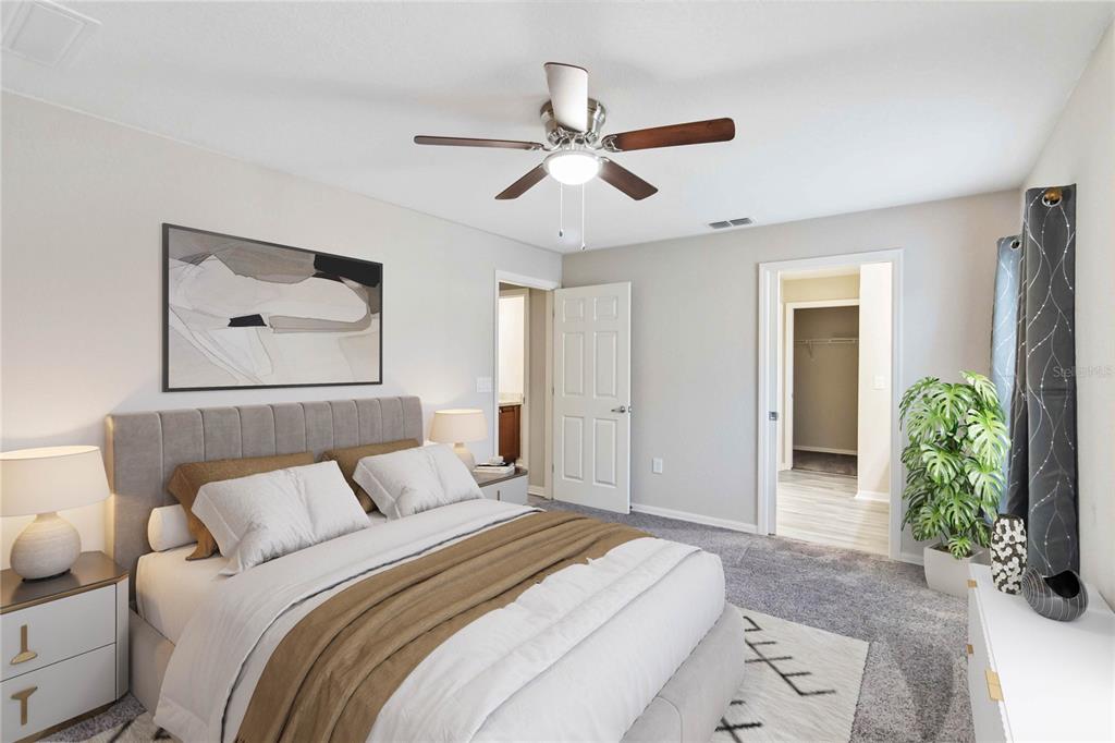 3723 Ricky Lane St. Cloud, FL 34772 - Photo 16 of 36 a bedroom with a bed and a painting on the wall