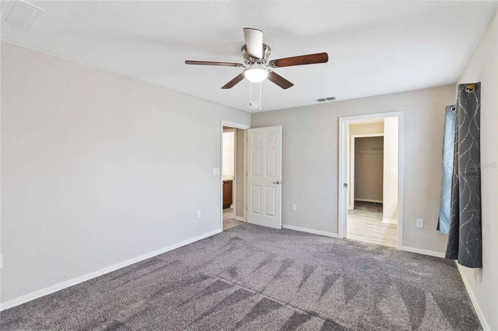 3723 Ricky Lane St. Cloud, FL 34772 - Photo 17 of 36 a view of an empty room and chandelier fan