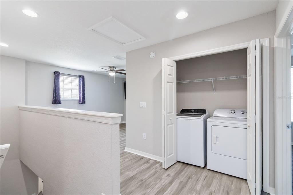 3723 Ricky Lane St. Cloud, FL 34772 - Photo 20 of 36 a kitchen with a refrigerator and a stove top oven