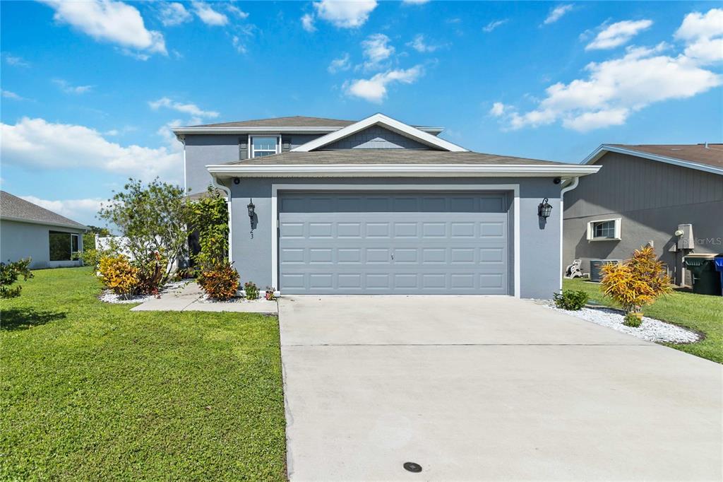 3723 Ricky Lane St. Cloud, FL 34772 - Photo 2 of 36 a front view of a house with a yard