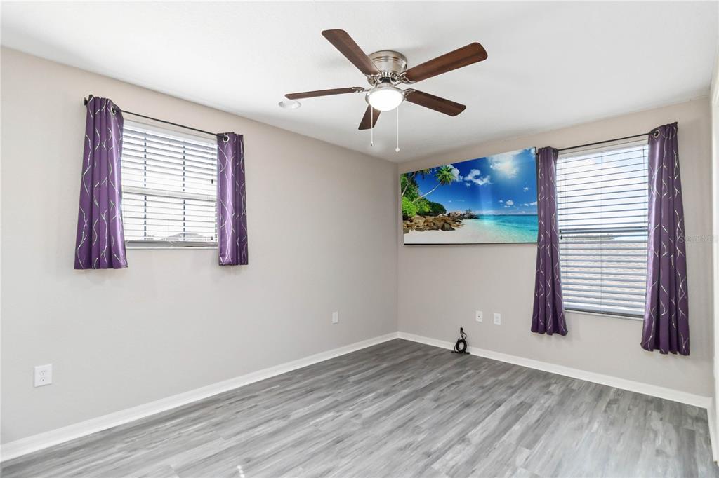 3723 Ricky Lane St. Cloud, FL 34772 - Photo 21 of 36 a view of an empty room with wooden floor and a window