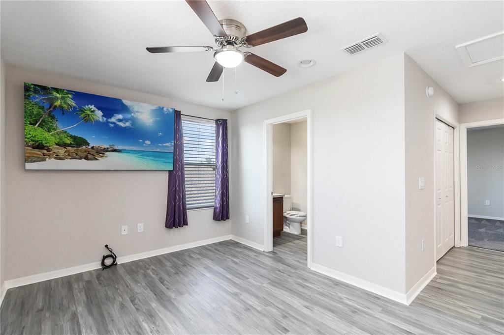 3723 Ricky Lane St. Cloud, FL 34772 - Photo 22 of 36 wooden floor in an empty room with a window