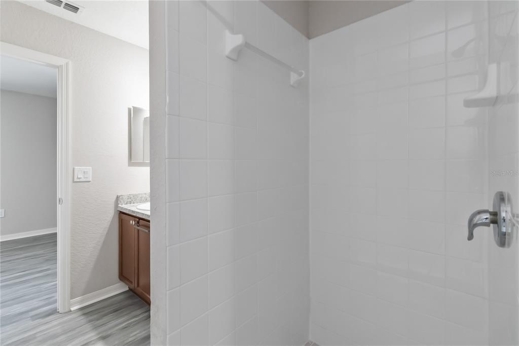 3723 Ricky Lane St. Cloud, FL 34772 - Photo 24 of 36 a bathroom with a shower and a sink