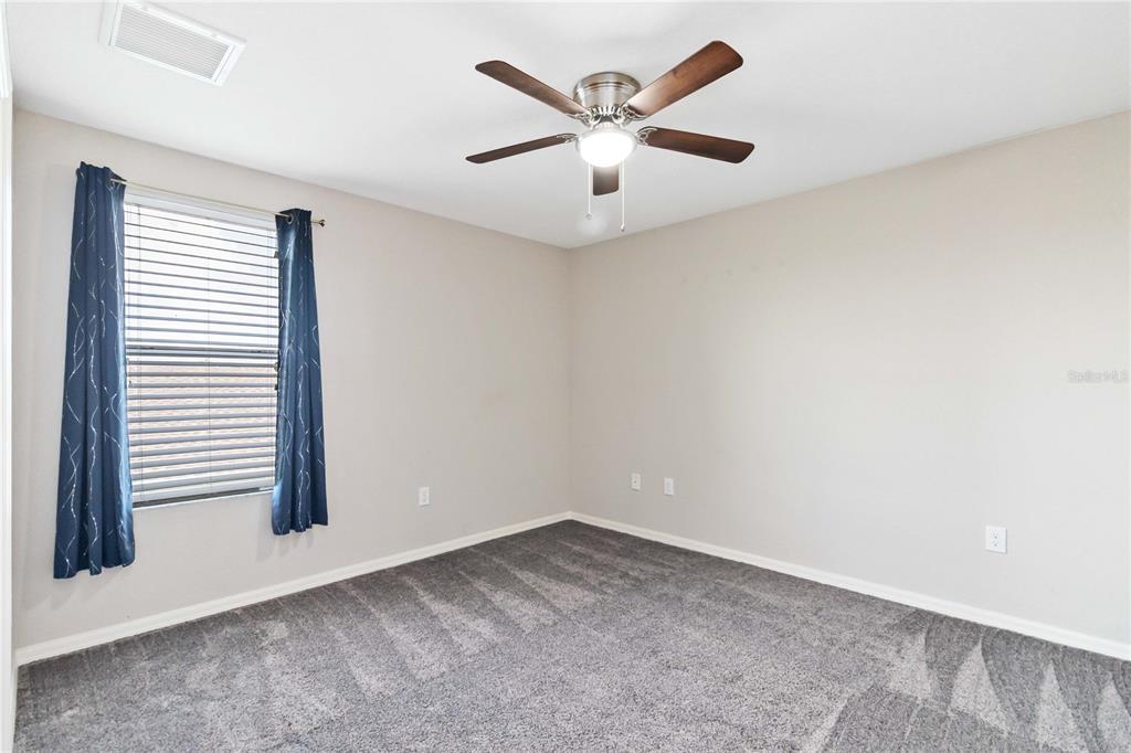 3723 Ricky Lane St. Cloud, FL 34772 - Photo 25 of 36 an empty room with a window and ceiling fan