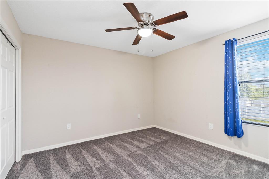 3723 Ricky Lane St. Cloud, FL 34772 - Photo 28 of 36 an empty room with wooden floor and windows
